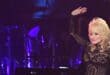 US singer-songwriter and 2019 MusiCares Person Of The Year Dolly Parton waves after performing onstage at the 2019 MusiCares Person Of The Year gala at the Los Angeles Convention Center in Los Angeles on February 8, 2019.