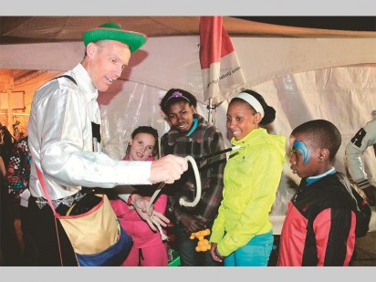 People are amazed by the magic tricks performed by Jumbo the Clown.