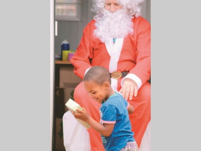 A Orient Hills pupil recieves his gift with a smile.