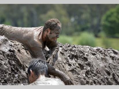A warrior challenges a muddy mountian. Photo by: zoonCronje.com