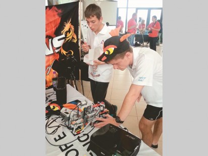 Wynand Wehmeyer and Leander Jacobs working on their team's robot.