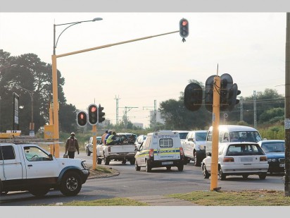 A police van sped through this red light without thinking twice.