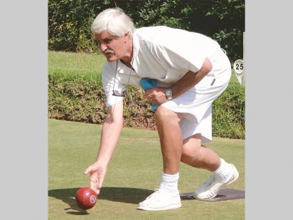 Mark Beckett consentrating hard while gently rolling his bowling ball.