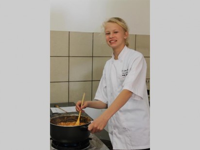 Sarah Burgees stirring her pot of goodness.
