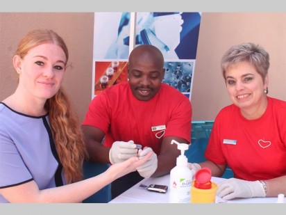 Charani du Randt gets tested by healthcare professionals Muzi Mkize and Jenny Sandilands.
