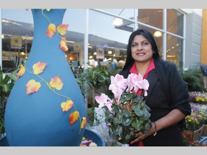 Sharon Govender of President Hyper showing off some of the flowers they have on sale to celebrate spring.