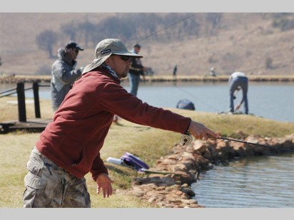 Gideon du Toit casting his line into the water.