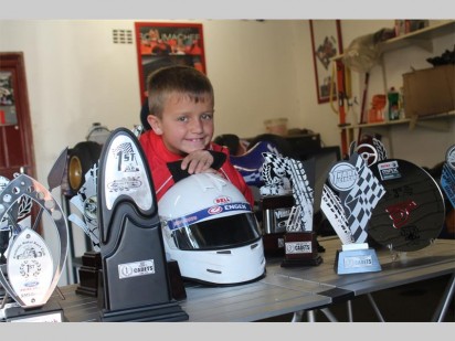 Jordan Brooks with some of the trophies he has won in go-carting.