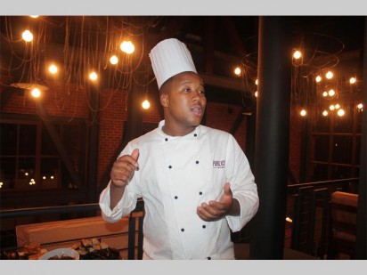 Former Masterchef SA contestant Luxolo Tabata, who is now a chef at the Publicity bar and grill at Silverstar, presents his array of snacks at the handover evening.