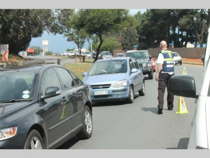 A Sector 4 CPF member directing traffic after the Burger Box tree incident on 21 November.