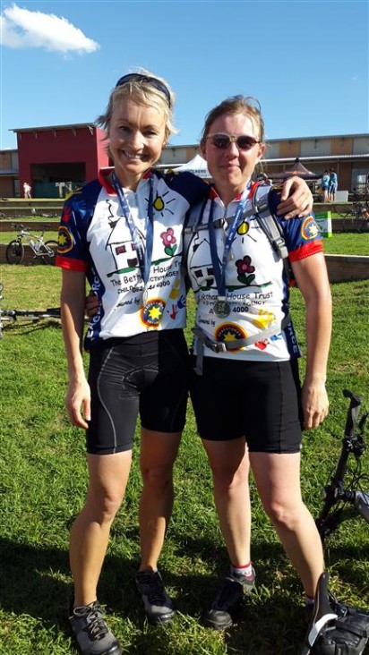 Two cyclists representing The Bethany House Trust Zelda ?? and May ?? with their medals for completing the Momentum 947 Cycle Challenge.