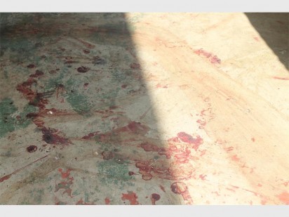 Blood spatter in the passage of block of flats in Mindalore.