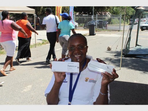 Nurse Gusta Nkoana preparing to help 22 young women with pregnancy prevention.