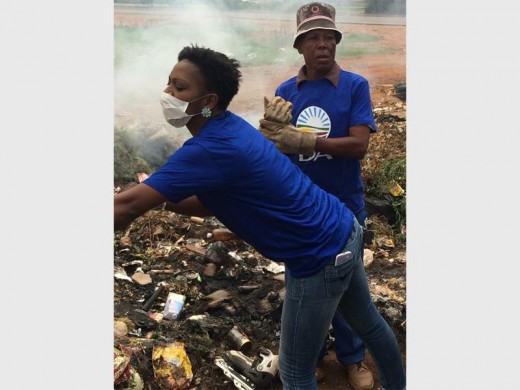 DA activists giving a helping hand during a clean up initiative in the Munsieville area.