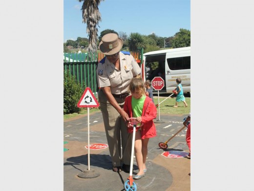 Gita Wehrstedt shows one of the girls how to use a traffic circle correctly.