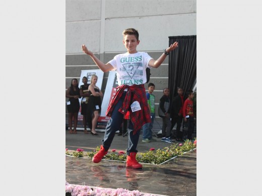 Charming the crowd with his beautiful smile.