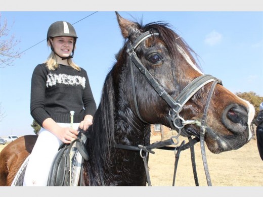 Nulé Steyn taking a break with Riley, her six-year-old Arab horse.
