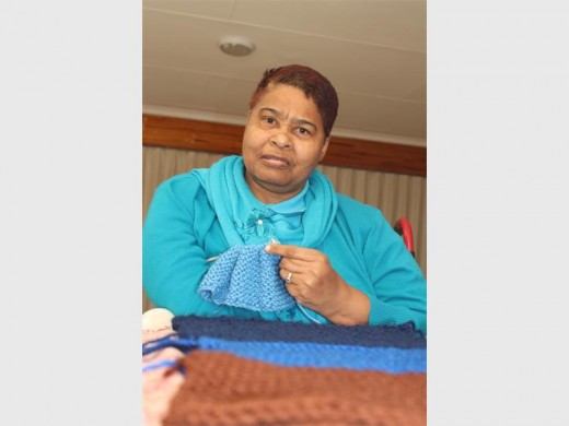 Ogle Maris knits the most beautiful scarfs with only one hand.