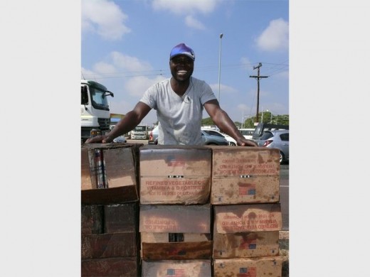 A runaway truck carrying refined vegetable oil from the American humanitarian aid USAID crashed with two vehicles. Nearby residents helped themselves to the 4liter oil cans which tumbled from the truck.