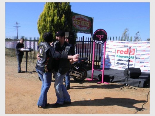 Riders from Tainted Souls Motorcycle Club danced to the music under the clear blue sky.
