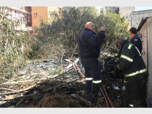 Firefighters on the scene after rubbish caught alight.