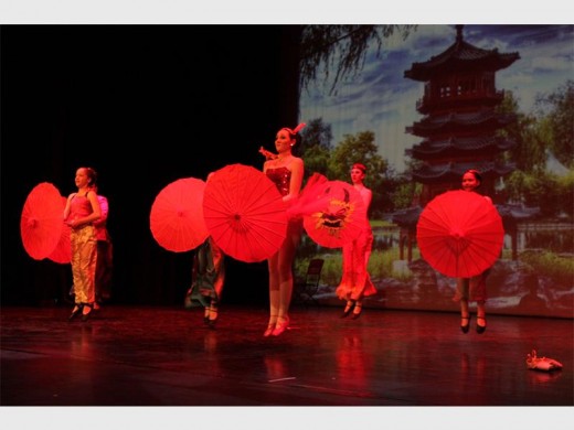 In Hong Kong the dancers enchant the audience with bright red colours on stage.