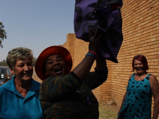 Millicent is overjoyed from the help that Ann has given her by just supplying her with a bit of food. In the back, Thea's face lit up at this moment.