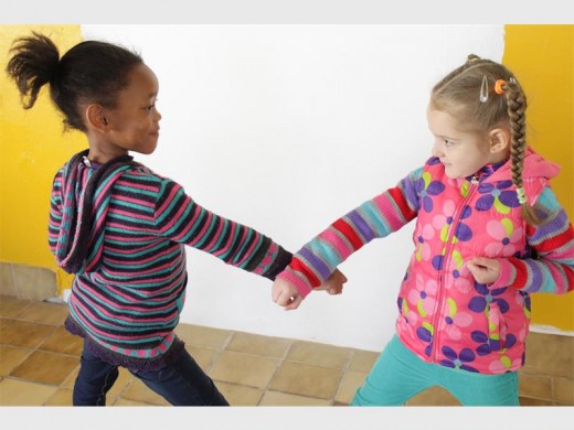 Lee-Anne Motsisi and Rochelle Smith in a competitive stance.