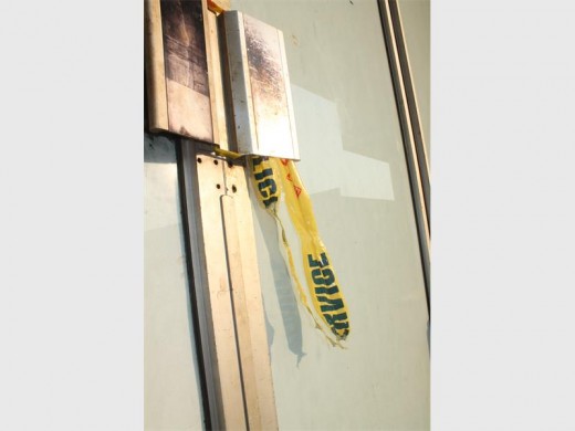 Police tape still hangs on the door of the club the morning after a man was beaten to death.