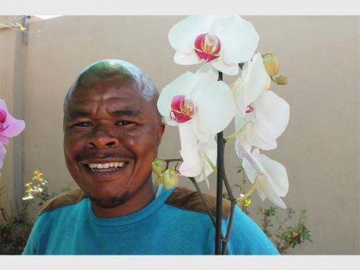 Benson Vikilahle known as the Orchid Man sells flowers by walking across Krugersdorp.