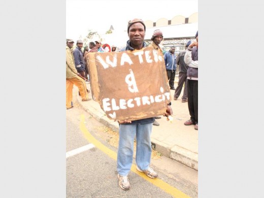 A make-shift sign asking for basic services.