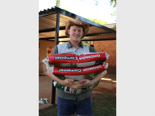 Marné Barnard carrying compost for the new veggie garden.