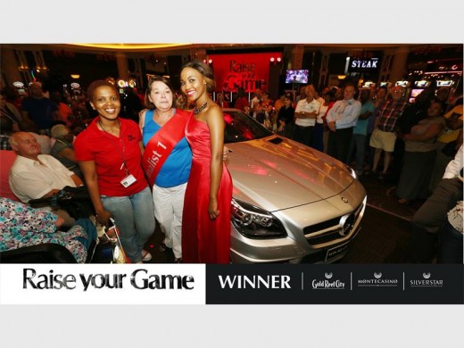 Sanele Ntombela (Marketing Manager at Silverstar Casino), Petronella Leimlehner (winner of a Mercedes Benz SLK) and a Silverstar promoter, pose for the camera shortly after the announcement.