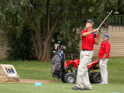 Steven Alexander, a Red Shirts member, attempting to strike a hole in one worth R100 000 for charity.