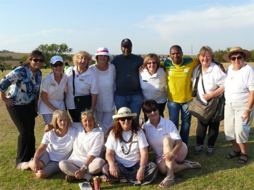 The women of the Muldersdrift Business Woman's Association with Guvon Hotel's Brenda Dooge (with white hat), Muldersdrift SAPS Spokesperson Warrant Officer Hitler Ngwenya and another member of the police.
