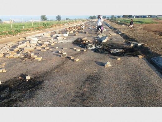 The remains of tyres that was burned yesterday in Tudor Road.