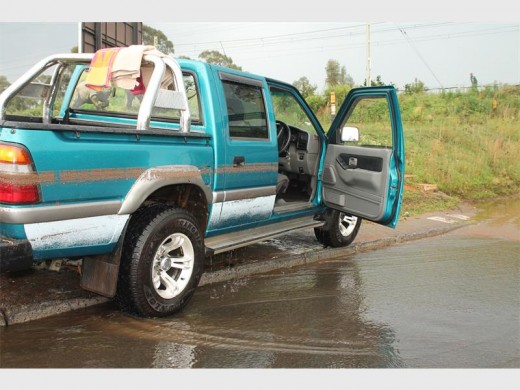 The water mark on the bakkie indicates the depth of the flood.