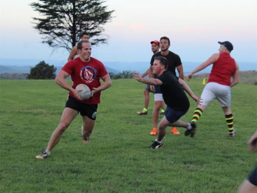 Louis Triegardt runs towards the goal line while trying to dodge his opponent.