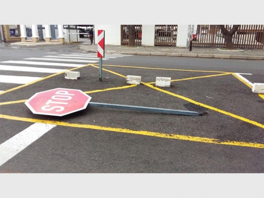 A stop sign was knocked over opposite Town Hall as protesters demonstrate their frustrations.