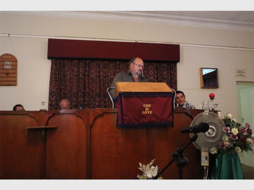 Pieter Brink, who also is a medium, delivering a message to someone in the sanctuary.