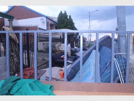 A mountain of furniture on the pavement in Luipaard Street as five drug dealers and their girls are evicted from a local drug house.