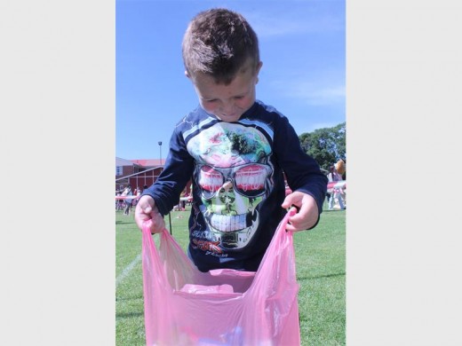 Zayden Coetzer counts his chocolate delights after taking part in the Real Life Church's fourth Easter Egg Dash.