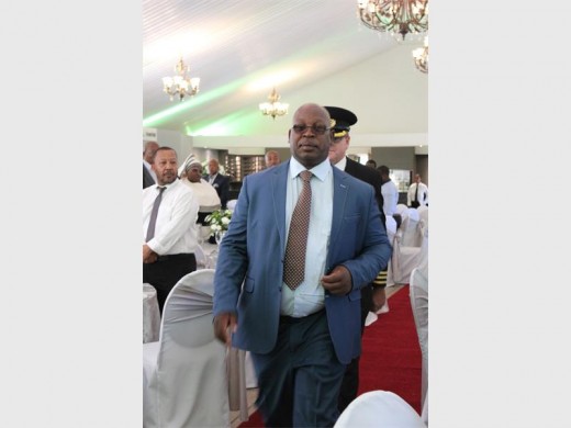 Mayor Mpho Nawa escorted to the podium at the State of the District Address on Friday, 1 April.