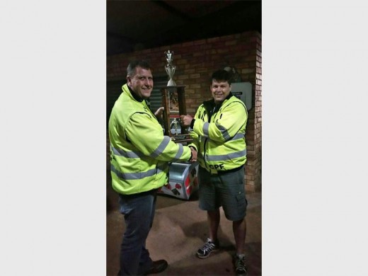 Sector 7’s Chairperson, Casper van Zyl hands over the trophy of the Patroller of the Year, Mark Trump.