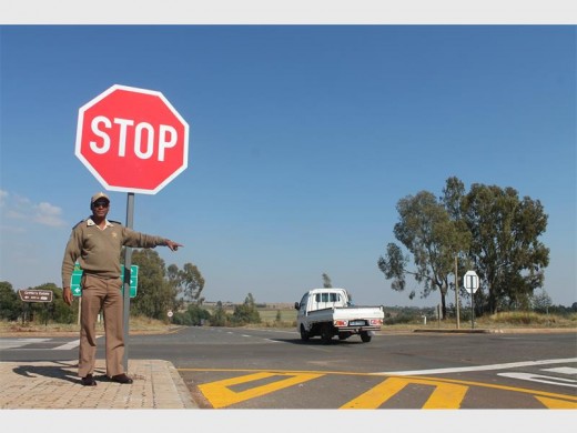 Mogale City Traffic Department's Papi Motaung at the N14/Ranfontein/Ventersdorp intersection where large stop signs were put up following the horrific accident which claimed two lives last month.