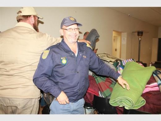 Warrant Officer Robbie Pain helping with the bulk drop of the blankets.