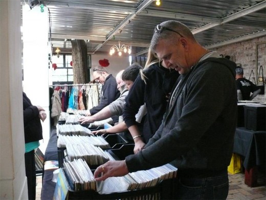 The sound of old music played on a turn-table got curious customers digging for more in the baskets filled with old vinyl LPs.