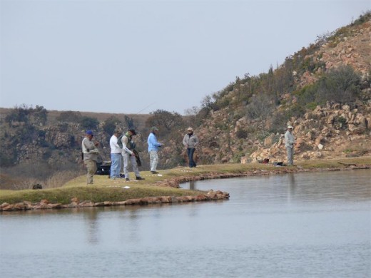 Some of the entrants in the Winter Fly-fishing Competition on the banks of a dam at Kloofzicht Lodge. Photo: Janine Viljoen.