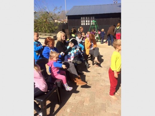 The children eagerly await their fun day.
