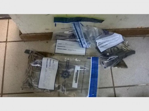 A gun and ammunition were found during a search operation at Madala hostel. Photo submitted.
